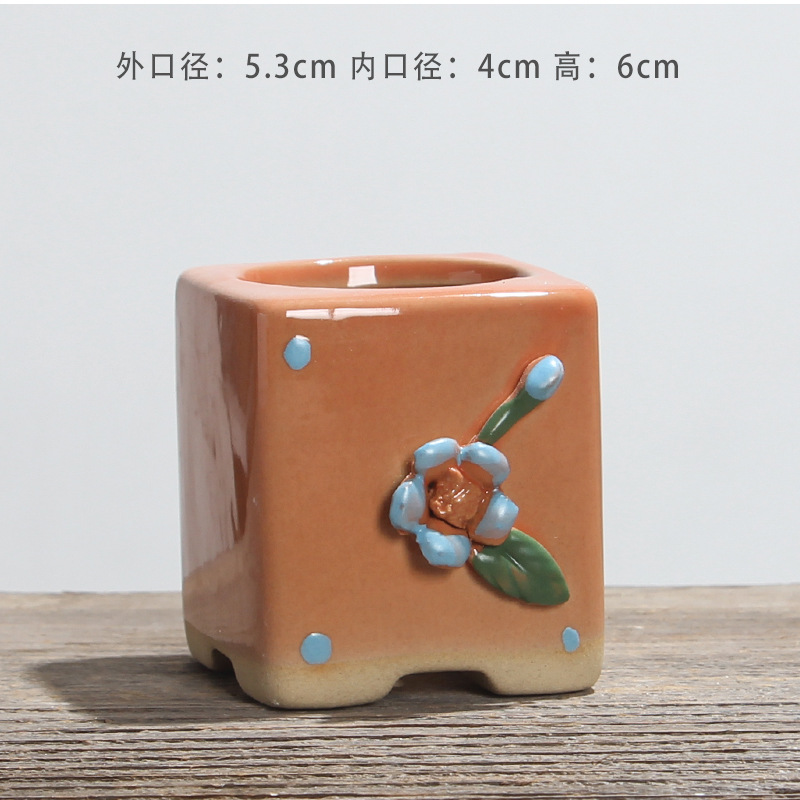 Flor de pellizco manual naranja.