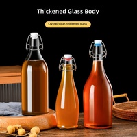 Bouteille en verre transparente à fermeture hermétique pour jus de fruits, lait enzymatique, boissons et huile domestique, vente en gros