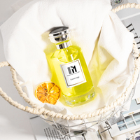 Botella de perfume cilíndrica acanalada de lujo de 30ml, 50ml y 100ml, diseño de vidrio transparente con tapa y embalaje personalizables