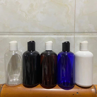 Bouteille de shampooing et de lotion en plastique transparent bleu, noir, ambre, blanc de 250 ml Hengjian avec bouchon à disque pour les soins capillaires