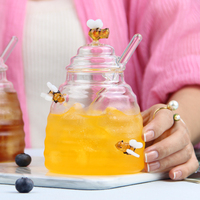Pot en verre de décoration d'abeille personnalisé en usine conteneur de miel en verre à haute teneur en borosilicate pot de miel en verre soufflé à la main avec louche