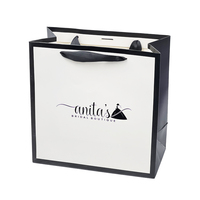 Haute qualité 300gsm emballage cadeau boutique sac papier sacs personnalisés imprimante efficacement billingue dinosource vêtements sac en papier