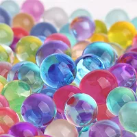 Jouet Orbeez. Boules D'hydrogel Multicolores Ou Perles D'eau Dans Des  Gobelets En Plastique, Vue De Dessus. Boules De Gel Souples