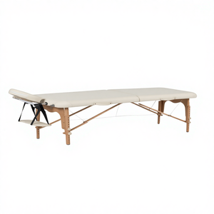 Table de massage pliable en bois, lit de relaxation pour <span class=keywords><strong>spa</strong></span> et physiothérapie, fabricants de lits de tatouage portables légers et fermes en PVC, vente en gros - Product Image 1