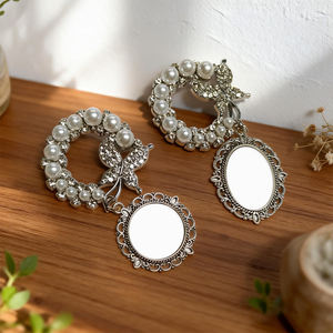 เข็มกลัดประดับมุกและผีเสื้อแบบซับลิเมชั่น - เข็มกลัดเปล่าสำหรับงานรีดร้อน รูปทรงกลม/วงรี สำหรับใส่รูปภาพตามสั่ง - Product Image 1