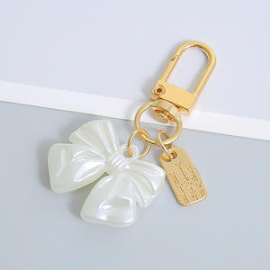 Élégant Vintage Rose Arc Perle Acrylique Porte-clés Femmes À La Mode Alliage Métal Pendentif Porte-clés Porte-Monnaie Accessoires Élégant - Product Image 5