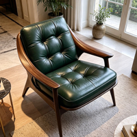Fauteuil lounge individuel en fibre de verre à grain de noyer, cuir capitonné vert foncé, pour un espace de vie rétro haut de gamme