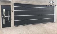 Porte de garage isolée en acier sur mesure avec fenêtres et accessoires