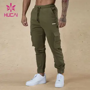 HUCAI Logo personalizzato abbigliamento sportivo tasche laterali atletiche pantaloni sportivi da uomo in cotone pesante pantaloni da jogging cargo da palestra
