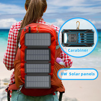 Batterie portable d'extérieur 20000 mAh avec câbles intégrés et 4 panneaux solaires pliables pour une alimentation de secours