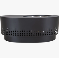 Brasero en métal ovale noir robuste, inspiré de l'Art déco, contemporain et modulaire, avec fond isolé thermiquement pour la sécurité des terrasses en bois