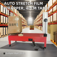 Machine semi-automatique d'emballage de film étirable en plastique à chaud pour boîtes en carton et bagages manuelle pour textiles chimiques