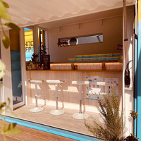 Maison conteneur durable en acier haute résistance, café-restaurant conteneur à faible coût et assemblage rapide, avec vérins électriques et circuits intégrés