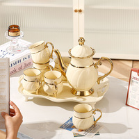 Nouvel ensemble de thé de luxe en céramique, peint à la main, doré, service à eau, théière et tasses en porcelaine pour le thé de l'après-midi, ensembles de café et de thé