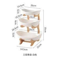 Minimalistische design drie-laags ronde houten fruitschaal met 2-3 liter capaciteit voor gebruik in de woonkamer en keuken, draagbare opbergoplossing voor servies.
