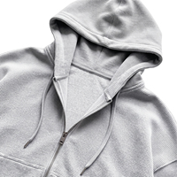 Sweat à capuche court et ample gris chiné en maille gaufrée épaisse de haute qualité avec fermeture éclair bidirectionnelle, personnalisable en gros pour hommes (OEM)
