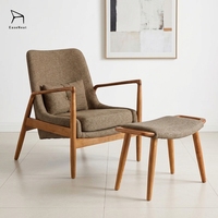 Fauteuil de loisirs individuel en bois massif avec assise rembourrée en cuir et repose-pieds pour usage intérieur