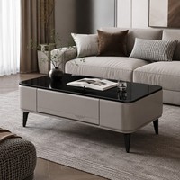 Table basse de salon moderne de luxe la plus vendue, avec pieds métalliques contrastants, finition brillante, rangement intégré et plateau en verre trempé