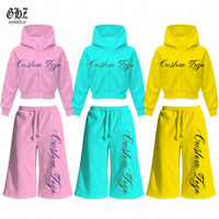 Ensemble de survêtement 2 pièces personnalisé pour femme avec logo, comprenant un sweat à capuche court zippé et un pantalon capri ample à cordon de serrage, style streetwear décontracté
