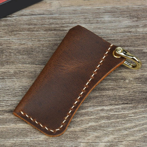 เคสหนังม้าบ้าแบบข้ามพรมแดน, จี้หัวเข็มขัดรูปเกือกม้า, เคสป้องกันไฟแช็คแบบพกพา, พวงกุญแจ - Product Image 1