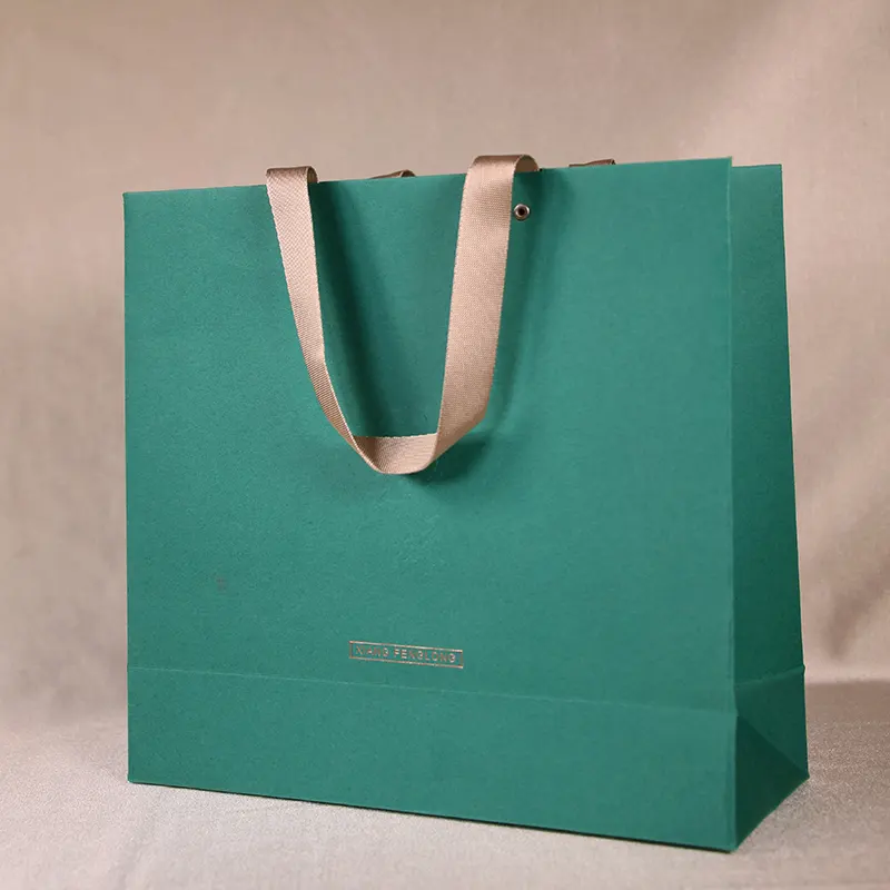 Bolsa de papel de embalaje reciclable para compras de regalo con impresión de logotipo personalizado, bolso de mano para tienda de ropa