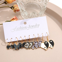 Vente en gros de boucles d'oreilles créatives avec pendentifs en forme de papillon noir, ensemble de boucles d'oreilles Tai Chi en forme de cœur, accessoires pour femmes