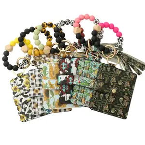 Anello portachiavi con perline in Silicone per uso alimentare con perline in legno e portafoglio da donna braccialetto con borsa nappine