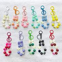 Promotion : Bracelet mignon à nœud perlé, pendentif cœur et fleur, accessoire de coque de téléphone, dragonne porte-clés, breloque colorée pour sac