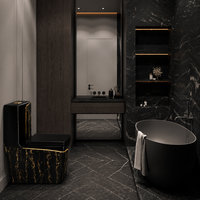 WC monobloc en céramique noire effet marbre, avec décorations dorées pour salle de bain de luxe