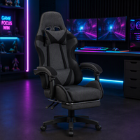 Chaise de gaming professionnelle moderne de direction, tissu gris, accents noirs, dossier ergonomique inclinable, repose-pieds extensible