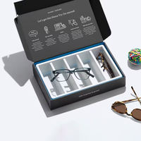 Boîte d'expédition de luxe noire et argentée avec logo et séparateur intérieur pour l'emballage de bouteilles en verre, de parfums et de lunettes de soleil