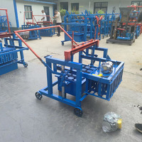 Petite machine manuelle simple pour la fabrication de pavés en béton, prix de la machine vibrante pour la fabrication de briques