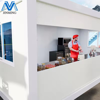 Café conteneur préfabriqué extensible | Café modulaire avec portes en verre et éclairage moderne