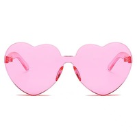 Vente en gros de lunettes de soleil transparentes sans monture Love Lunettes de soleil épaisses pour femmes couleur bonbon Lunettes de soleil une pièce avec cœur