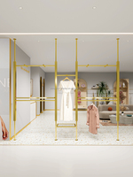 Présentoir pour vêtements de la boutique personnalisée Présentoir mural pour vêtements pour magasins de vêtements Présentoir pour vêtements doré pour magasin de vêtements