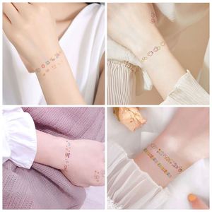 Pegatinas de tatuajes temporales con diseño de manos y rostros pequeños, estilo encantador y moderno - Product Image 4