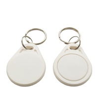 Porte-clés RFID étanches 13,56 MHz FM11RF08 prêts à être expédiés pour système d'accès aux portes, porte-clés RFID en plastique avec puce