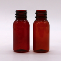 Flacon vide de 60 ml (2 oz) en PET transparent ambré avec bouchon inviolable anti-déversement pour sirop contre la toux et médicaments pour enfants