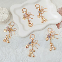 Porte-clés pendentif papillon lettre style minimaliste moderne, best-seller transfrontalier, pour VOUS, breloque de sac en métal alphabet anglais