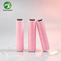Tube de rouge à lèvres vide rond rose au design populaire avec coupelle de recharge inclinée, emballage cosmétique en plastique pour rouge à lèvres et baume à lèvres en gros