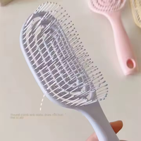 Brosse à cheveux ronde de massage du cuir chevelu bouclée mignonne de voyage personnalisée avec marque privée, massage du cuir chevelu en gros avec logo