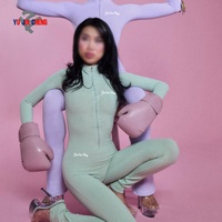 Combinaison de sport moulante personnalisée à manches longues avec fermeture éclair et pantalon évasé pour femme