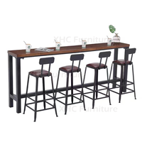 Ensemble table et tabourets de bar style industriel, structure métallique, plateau en bois, hauteur comptoir, pour pub, bar, café, restaurant, îlot de cuisine