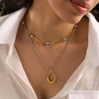 Collier pendentif goutte d'eau torsadé bicolore en acier inoxydable plaqué or 18 carats avec chaîne serpent or et argent – Cadeau