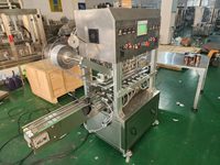 Machine automatique de cachetage de rouleau de film d'aluminium de tasse de bouteille de seau de pot de quatre têtes
