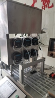 Machine automatique de remplissage et de scellage de coupelles et de pains de communion préremplis