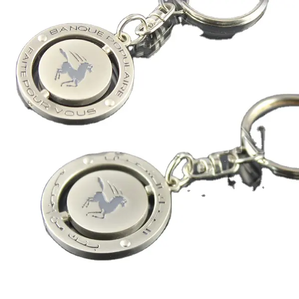 ترويجية مخصصة دوامة ميدالية مفاتيح معدنية مع شعار محفورة