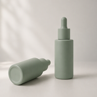 Flacon compte-gouttes cylindrique en verre vert mat de luxe OEM ODM pour sérum de soin de la peau