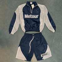 Ensemble de survêtement décontracté pour homme, coupe courte, léger, coupe-vent, demi-zip, color block, style vintage urbain, idéal pour l'été, personnalisable en usine