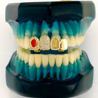 Ensemble de grilles dentaires en or tendance européen et américain, émeraude et zircon complet, accessoire dentaire hip-hop pour hommes, vente en gros pour Noël